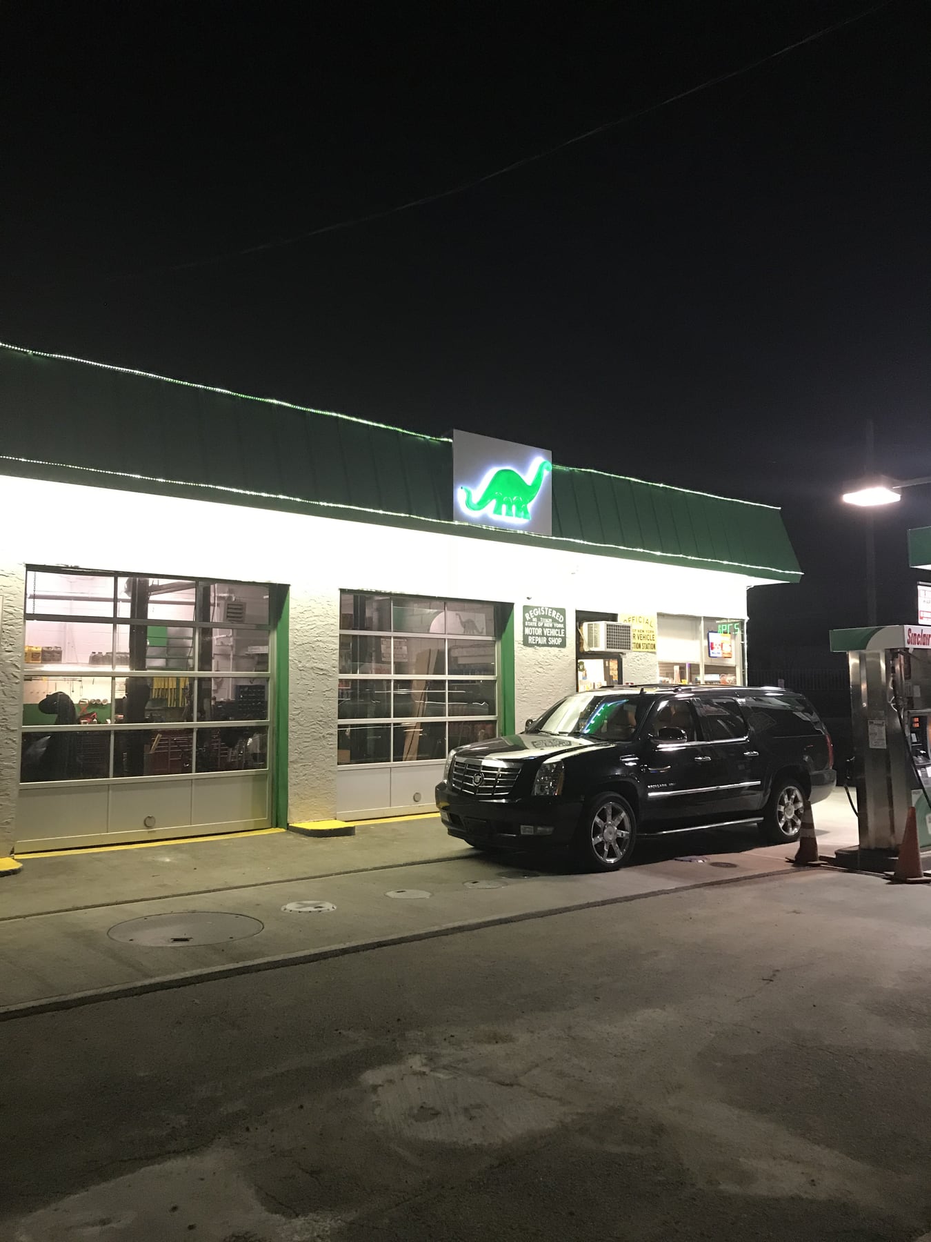 One Broadway Auto service bays lit at night